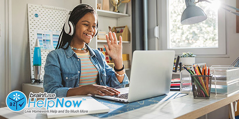 Teen waving to her laptop camera