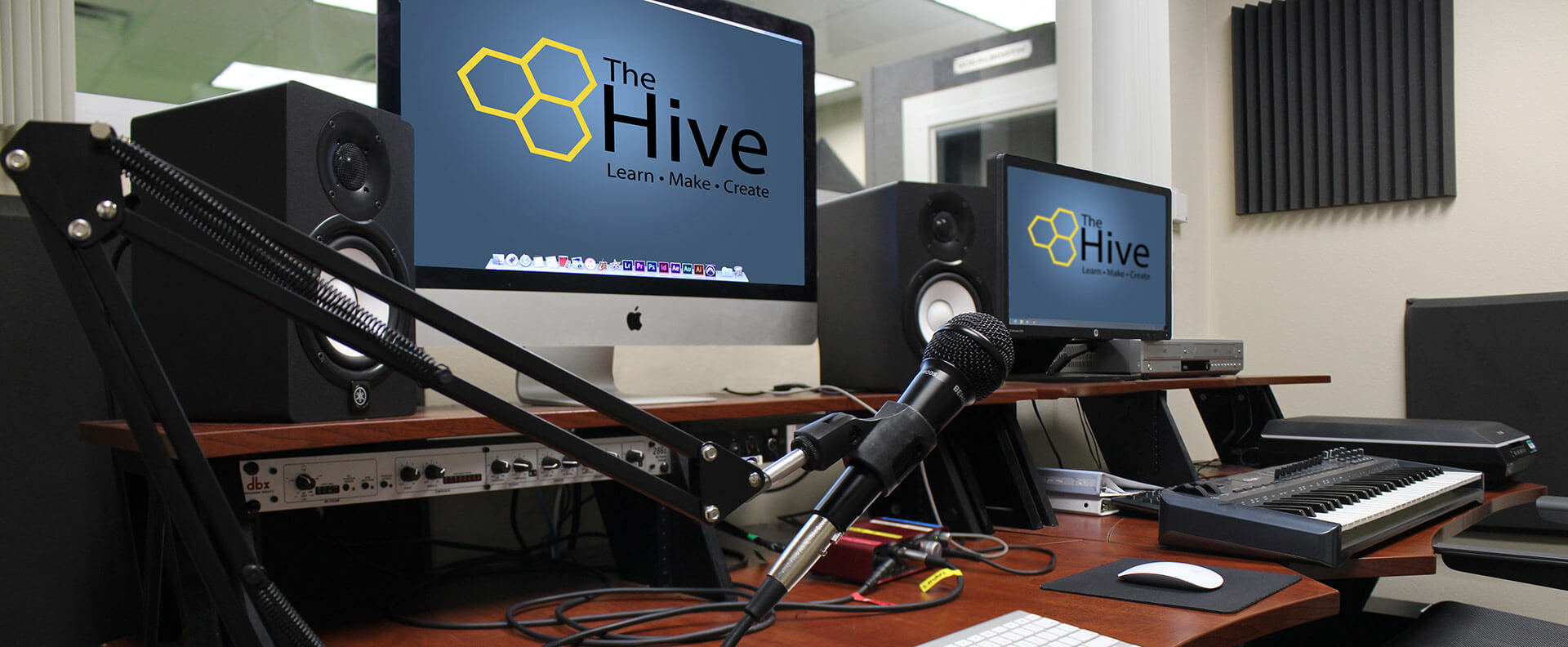 Digital workstation with monitors and microphone
